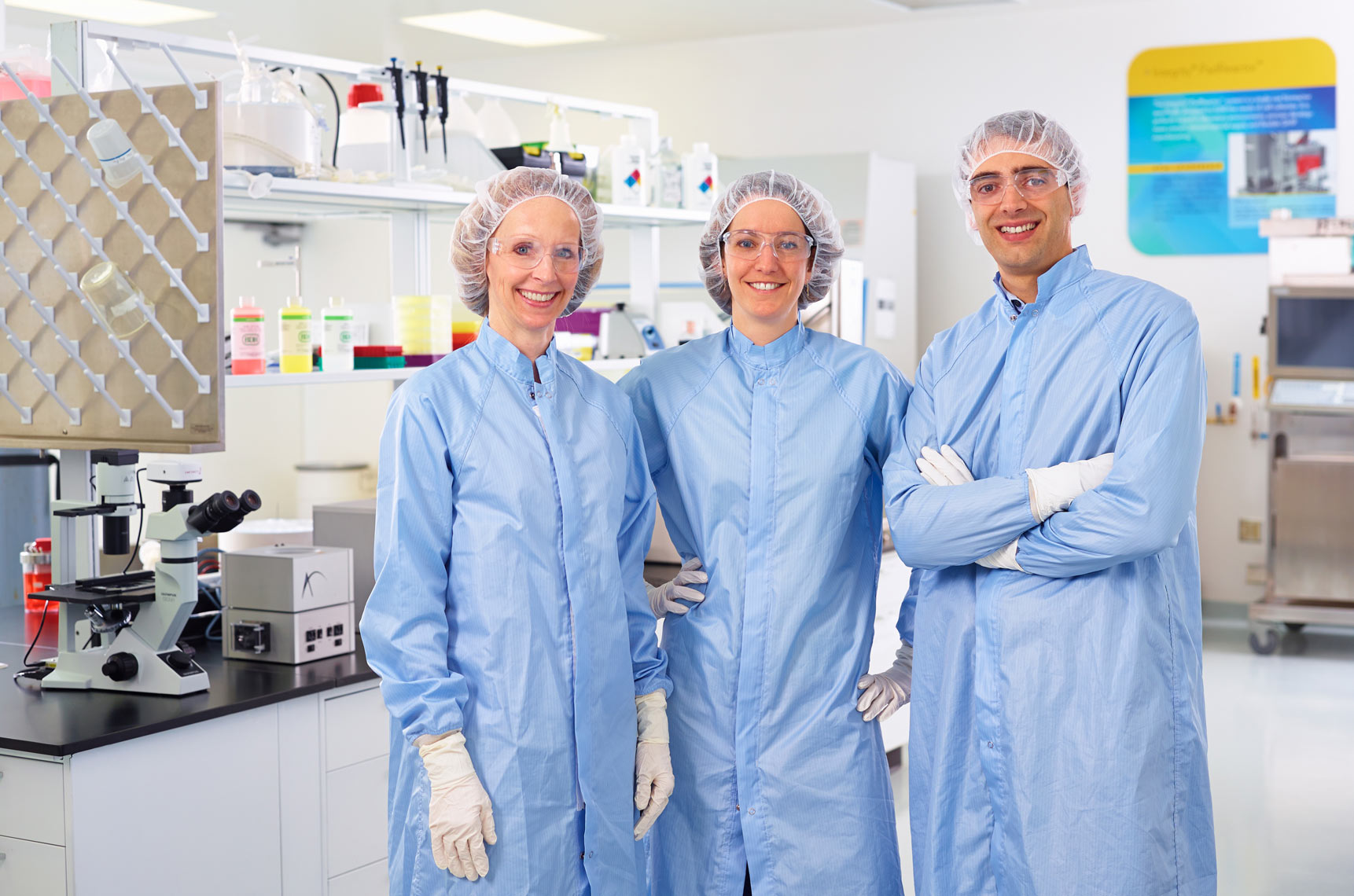 ATMI/lab techs/standing looking at camera/medical photography
