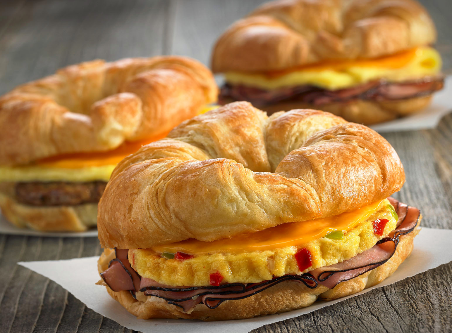 Croissant Breakfast sandwiches/grey barnwood table/food photography