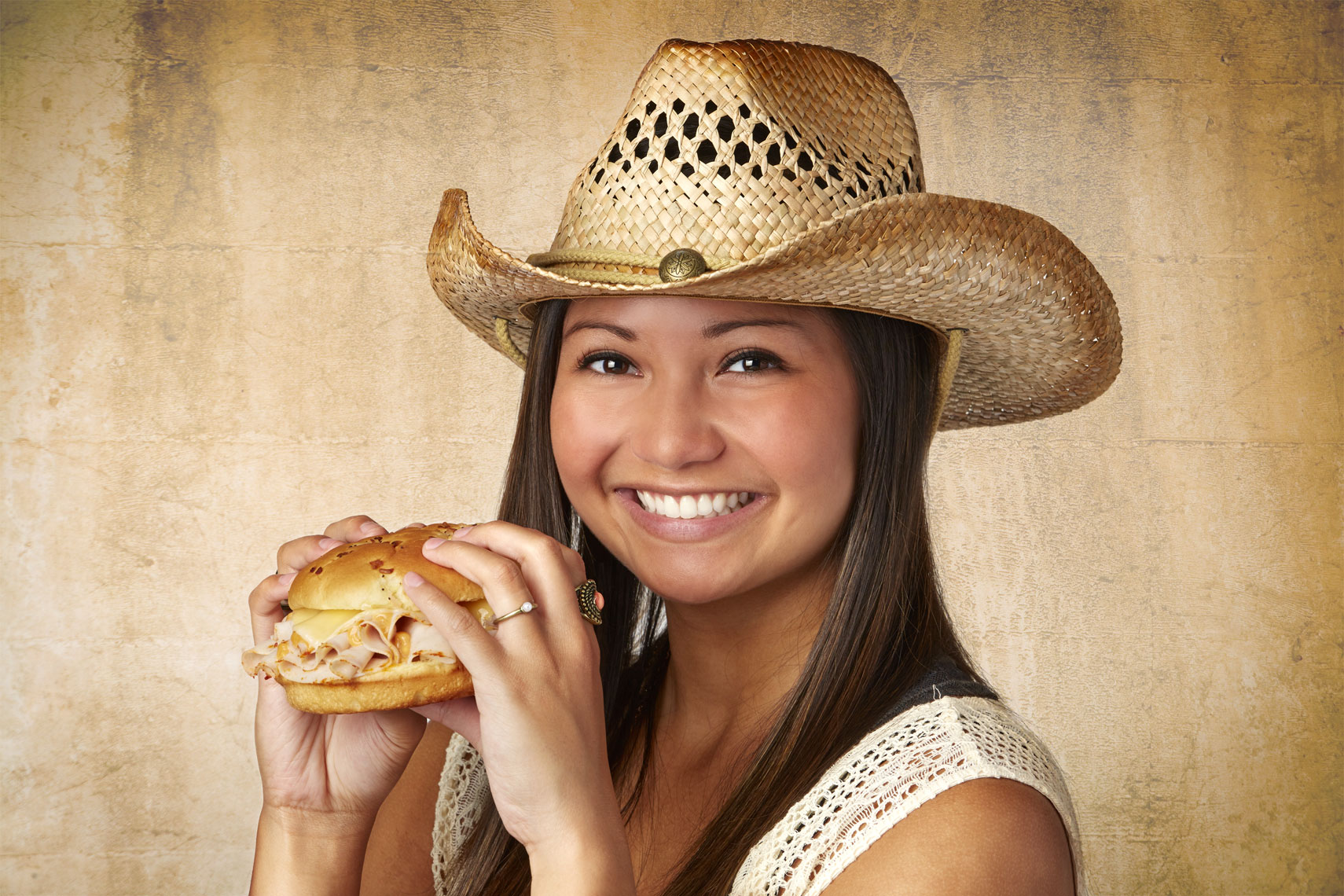 female-model-eating-ham-cheese-sandwich-lifestyle-photo