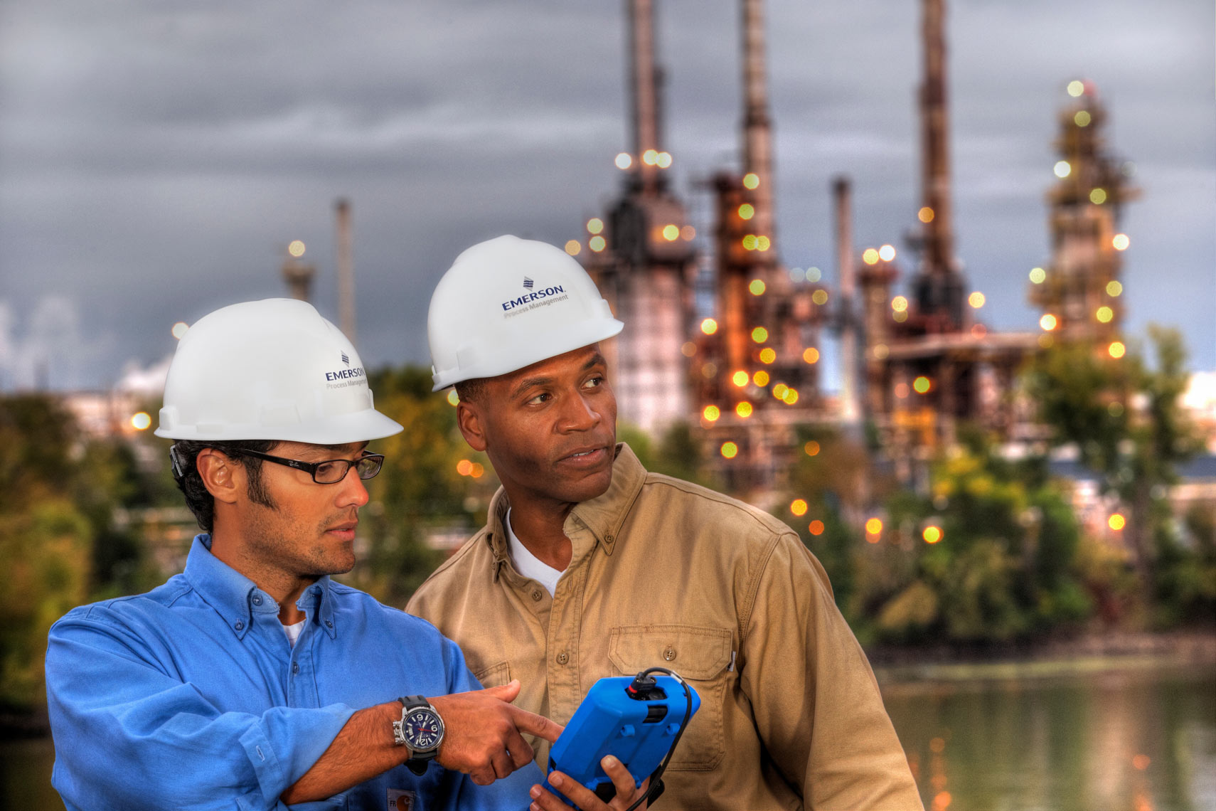 Oil Refinery/Two men talking/twighlight shot/Industrial photo
