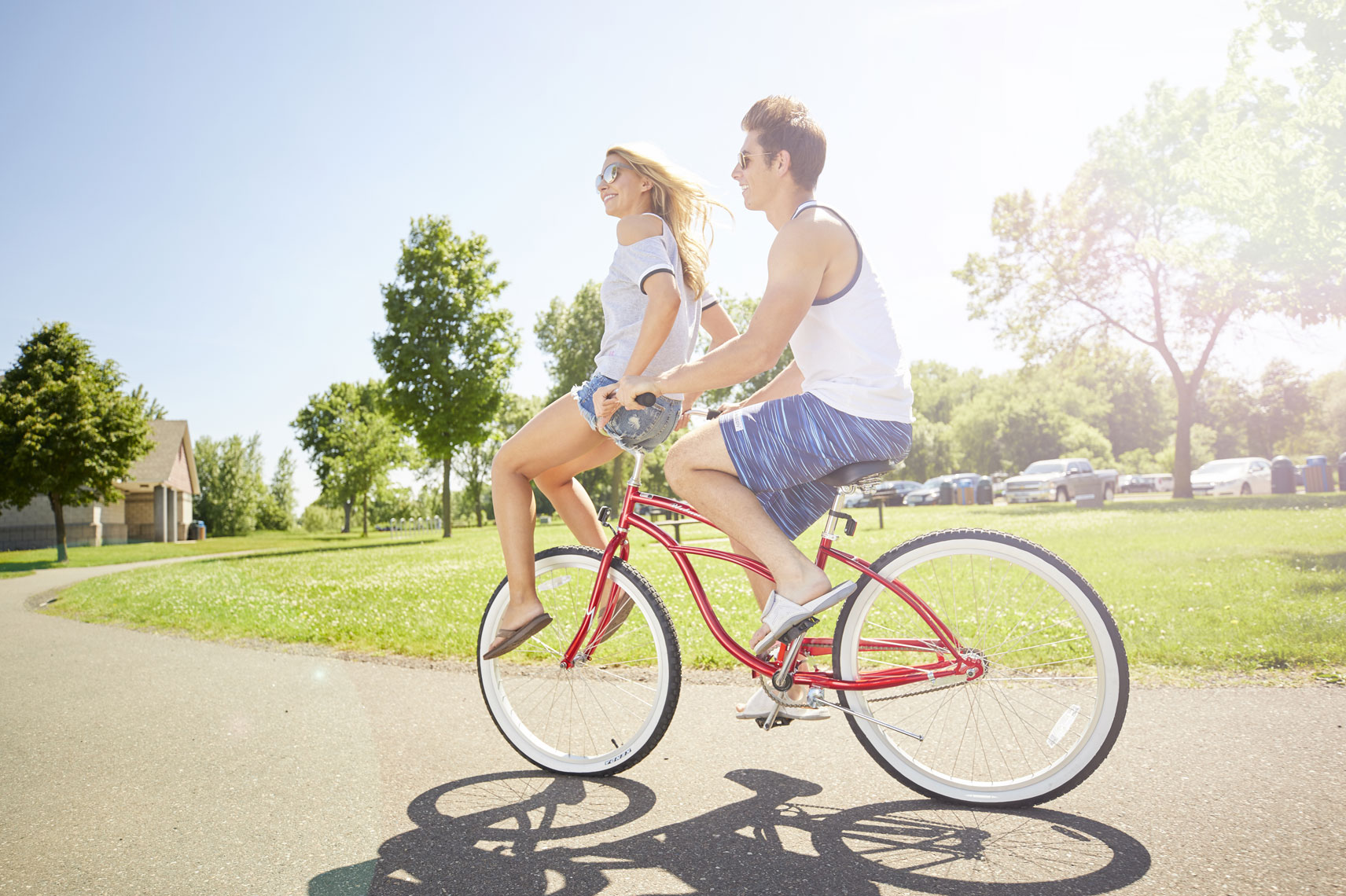 young couple on bike in summer, lifestyle
