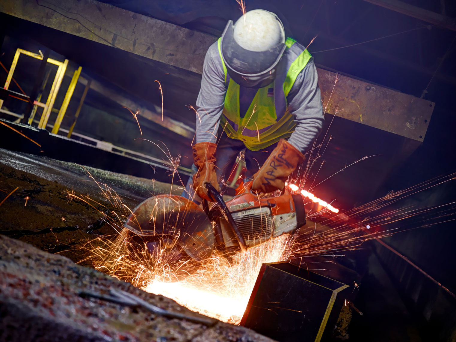 Fabcon Plant/Worker/ Lg saw/sparks flying/Indusrial photography