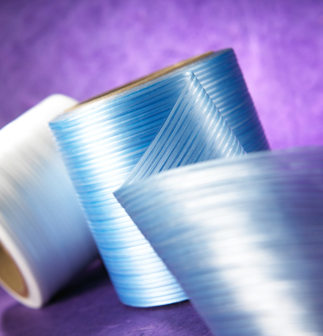 Medical tape/spools/blue/white/purple background/medical photography