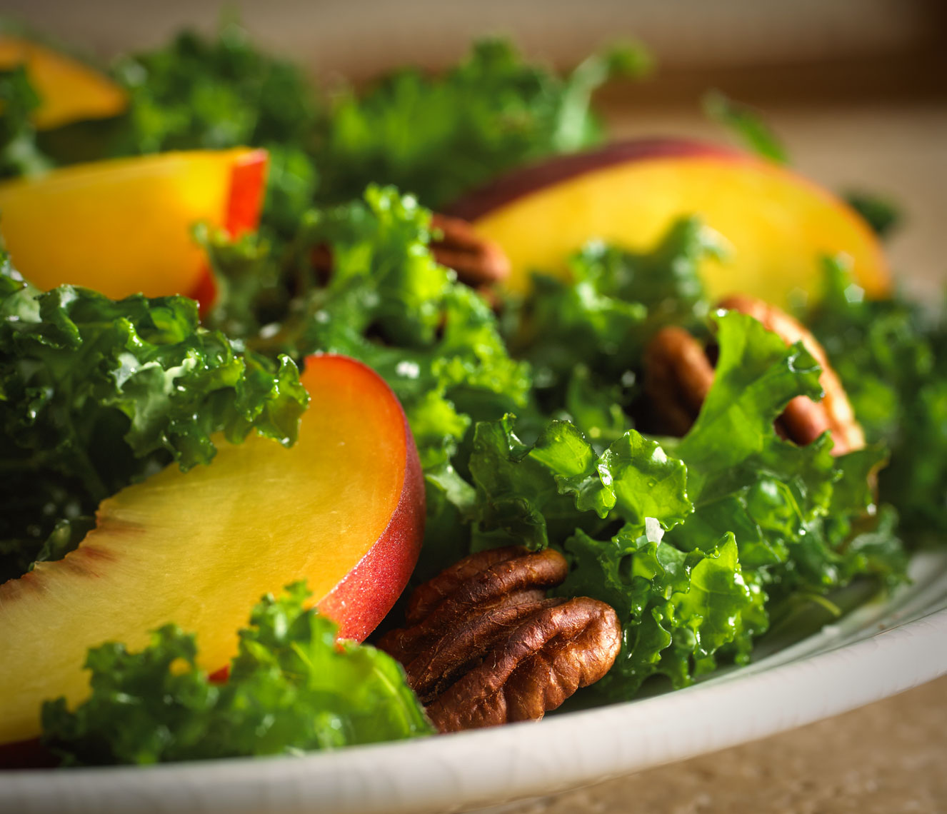 Walnut peach salad/large peach slices/walnuts on bed of greens/food photography
