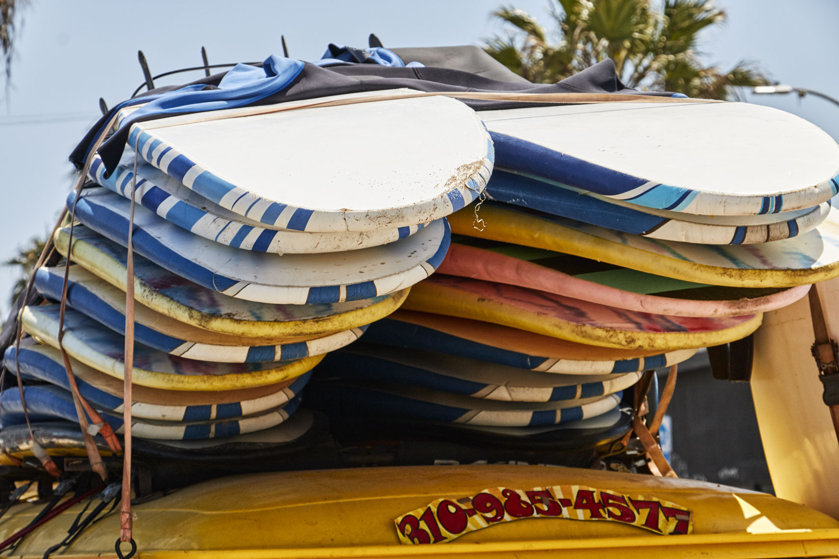 Stack of surf boards/top of car//locaton photography