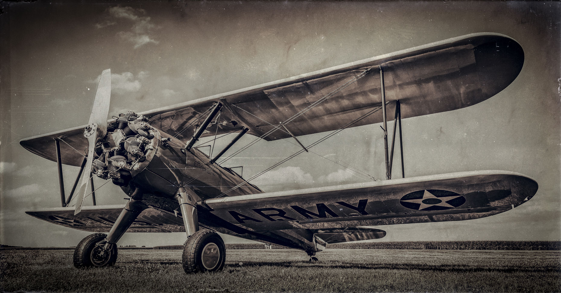 Old biplane/low angle/b&w/grass/aviation photography