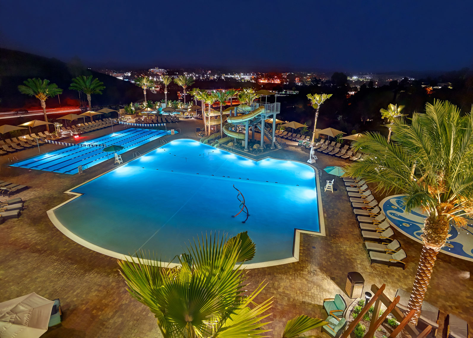 Pools/twisty slide/ lights/pool and deck/architectural photo