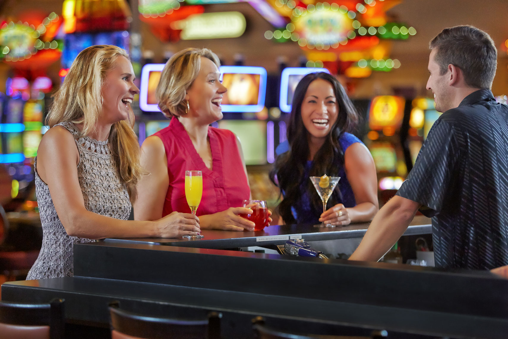 Little Six Casino/3 women at bar laughing/lifestyle people photography