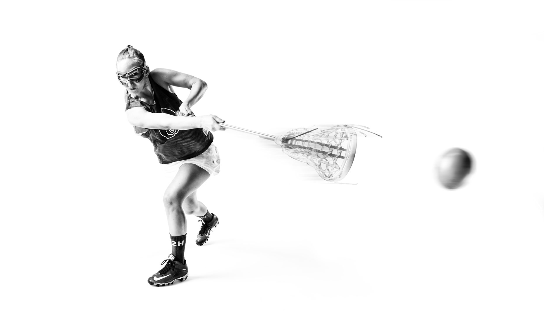 Girl/lacrosse/throwing ball/b&w/lifestyle photography