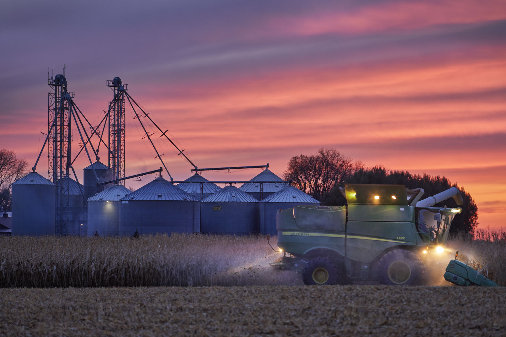 John Deere/farm equipment/silos/sunset/agricultural photography