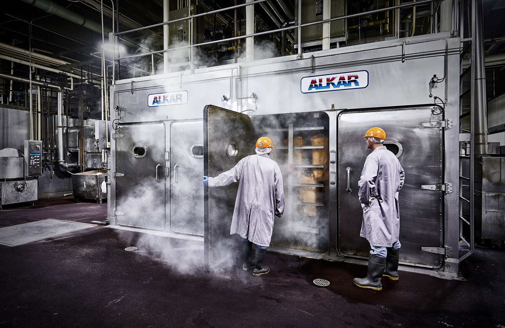 Bacon factory/workers looking into cooker/location photography