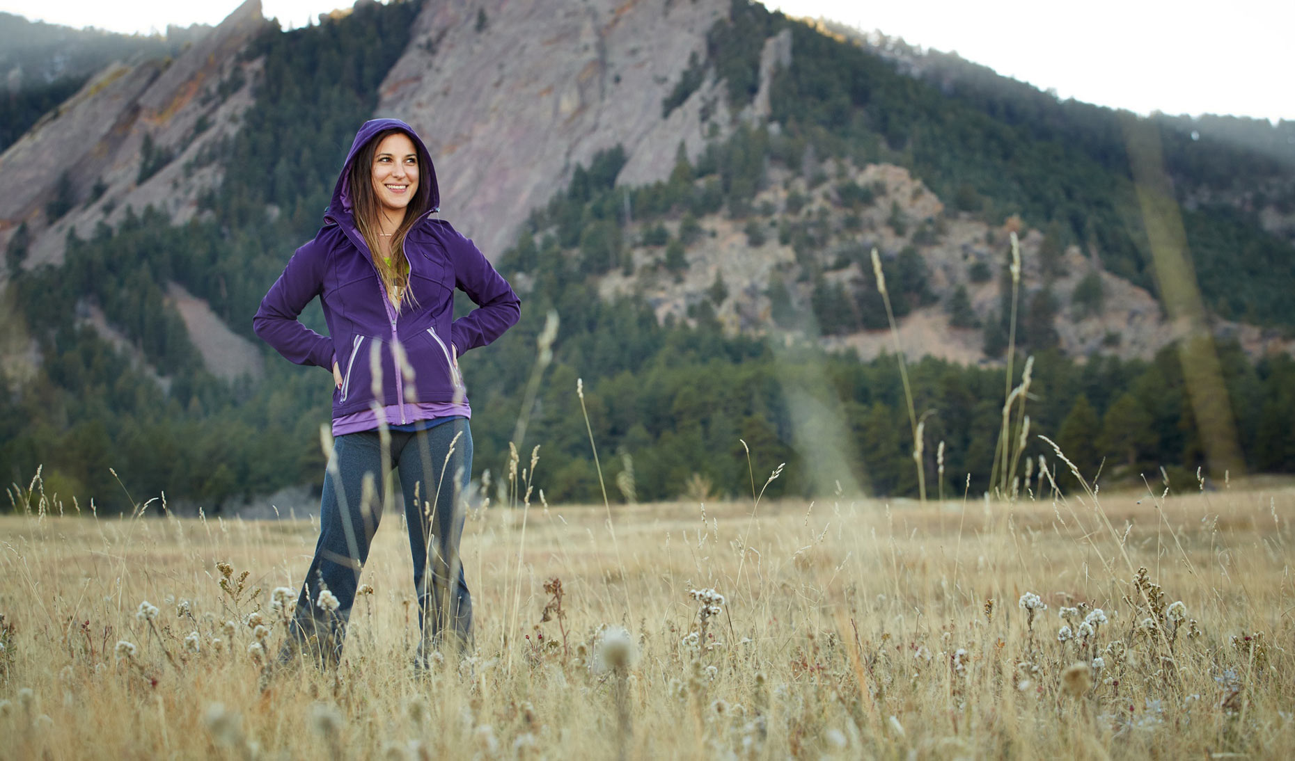 Otto Bock/woman in field/mountains/purple hoodie/lifestyle photography