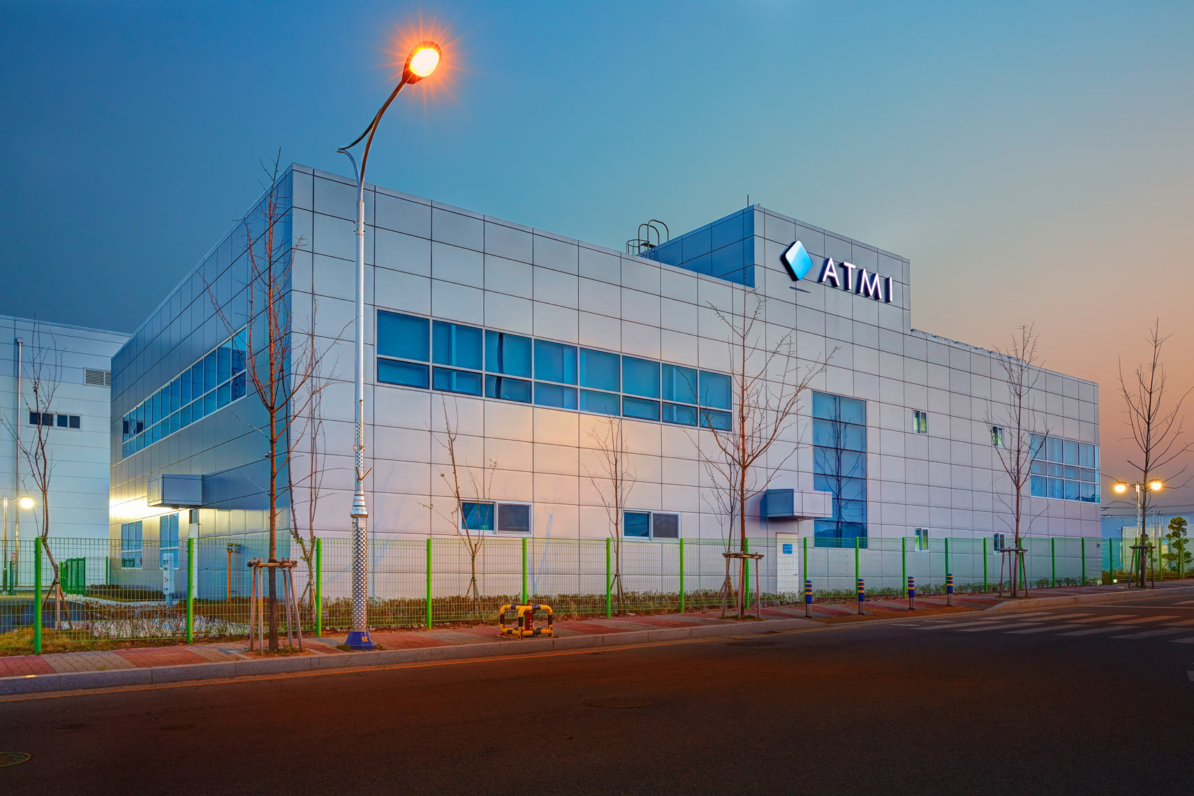 ATMI building exterior/silver façade/high windows/architectural photo