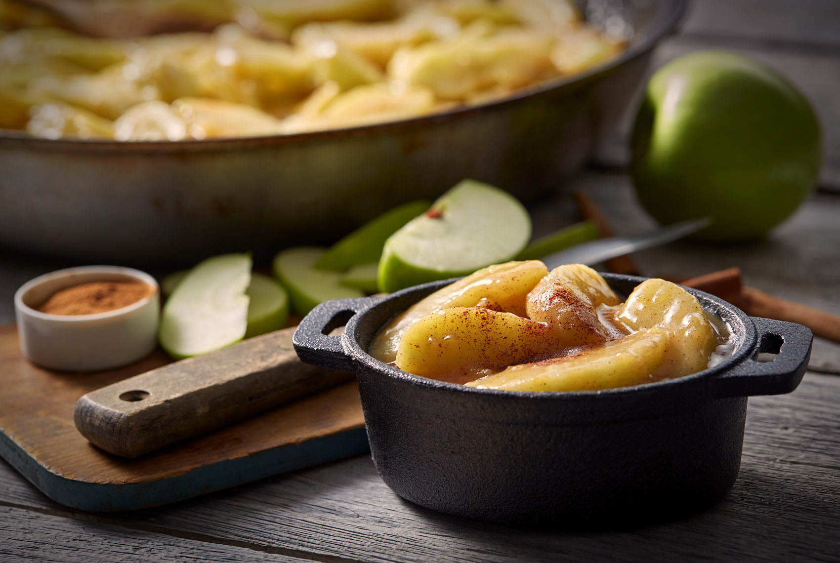 Baked apples/cinnamon/small cast iron dish/food photography
