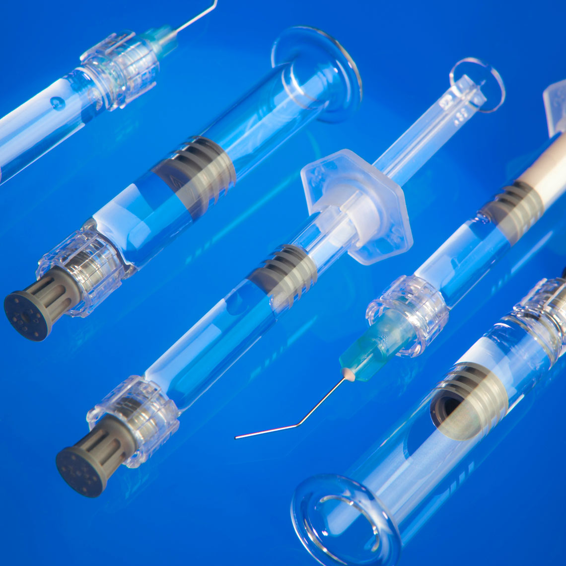 syringes/group/blue glass background/medical photography
