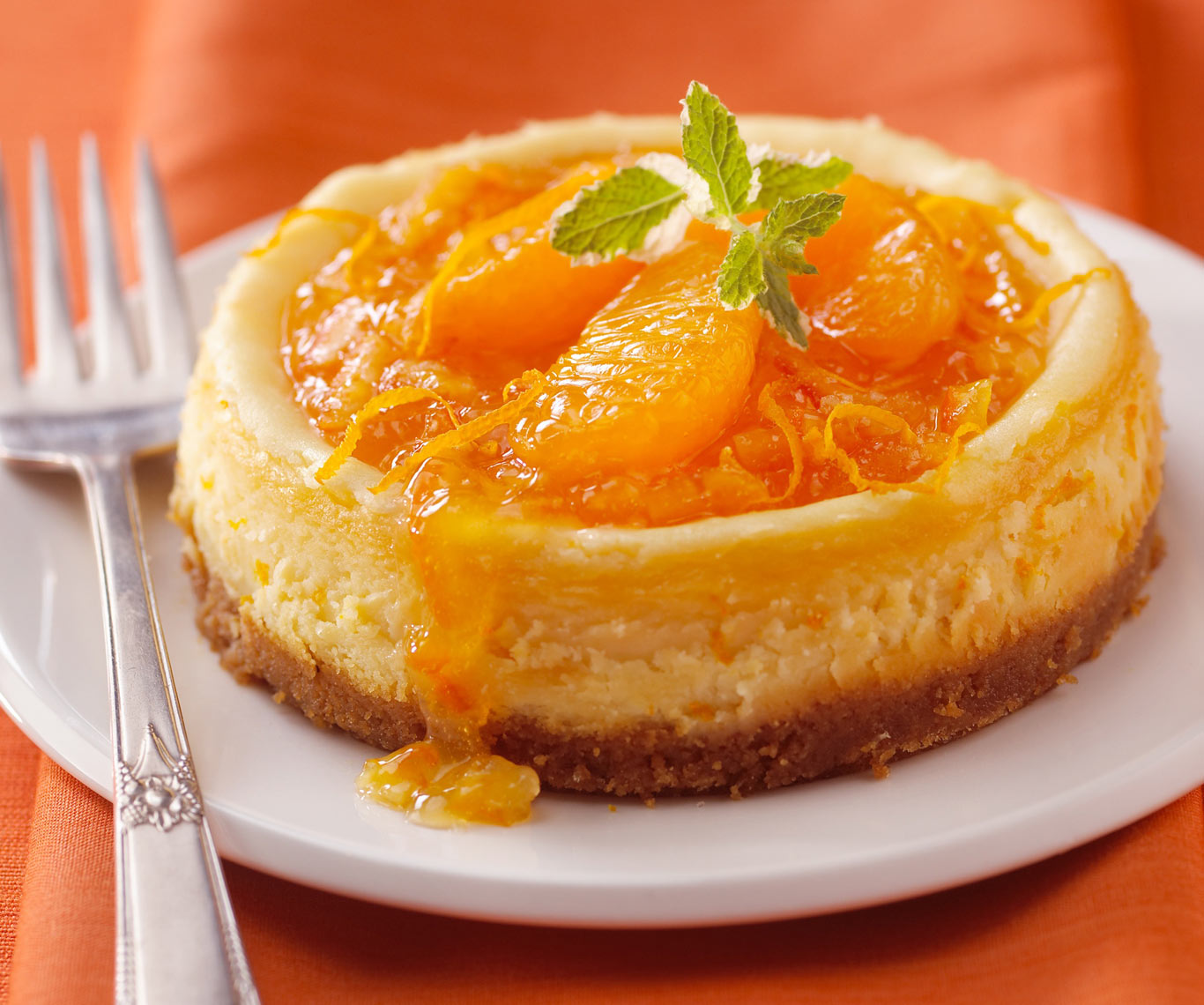 orange cheesecake/white plate/orange napkin/food photo/InsideOut Studios