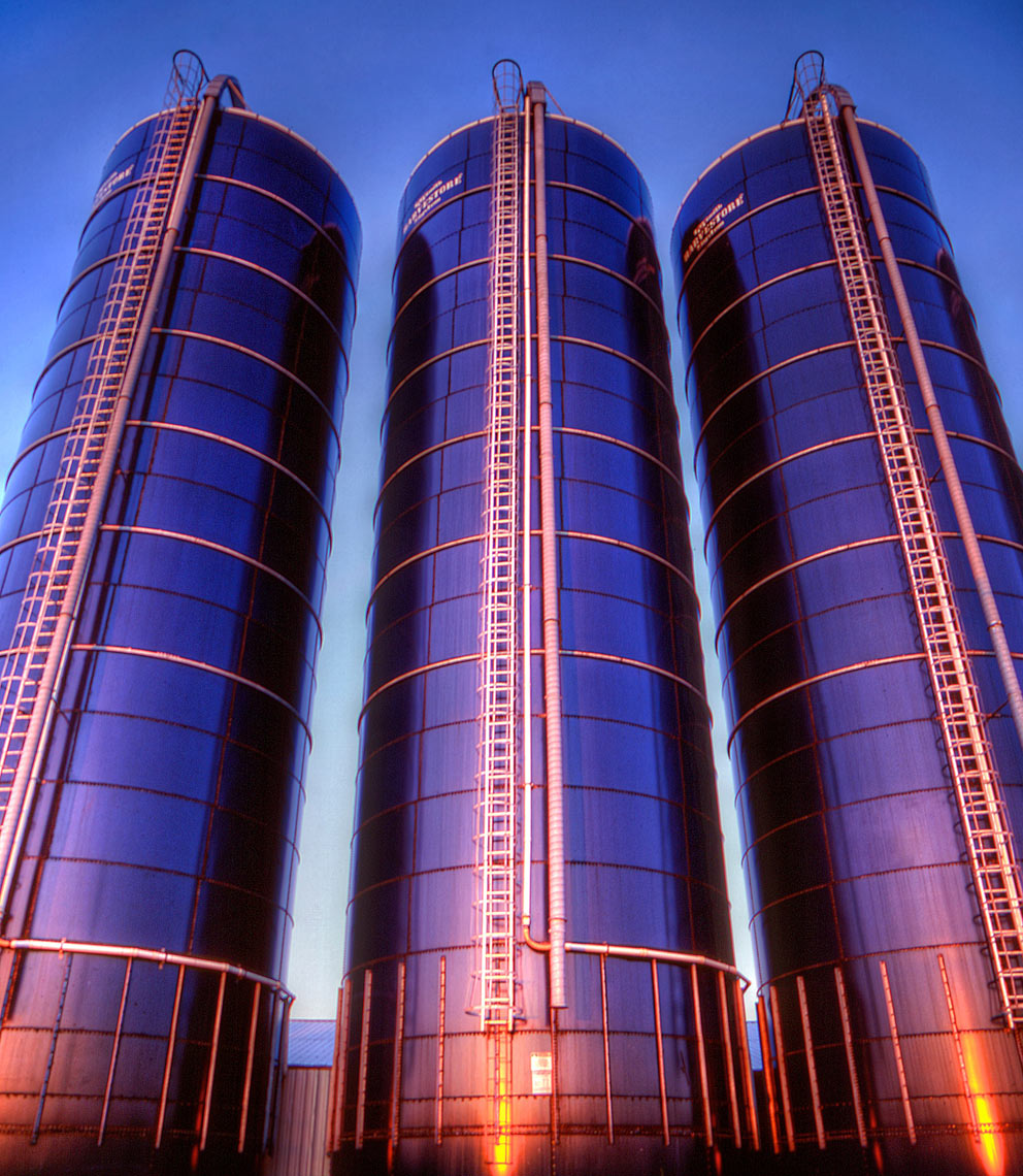 Three silos/sunset reflecting/blue sky/agriculture photography